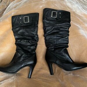 Almost new,beautiful black leather women boots from Brazil. Size 8 M.